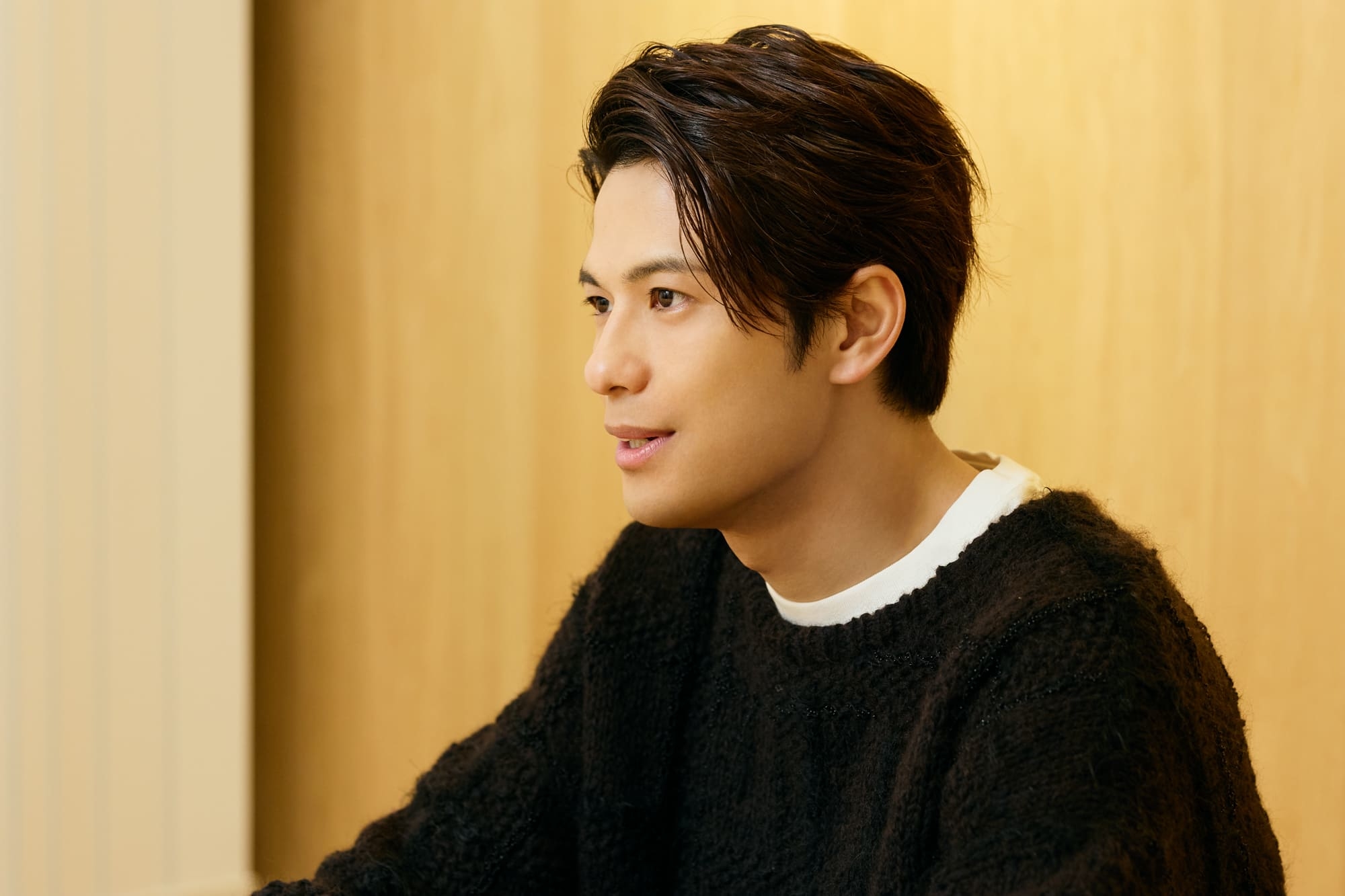 Win Morisaki answering an interview indoors