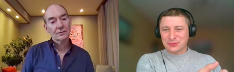 The remote interview. A front-on screen capture of Campbell on the left half of the image and Vitaly Zhigarko on the right, wearing headphones and being interviewed.